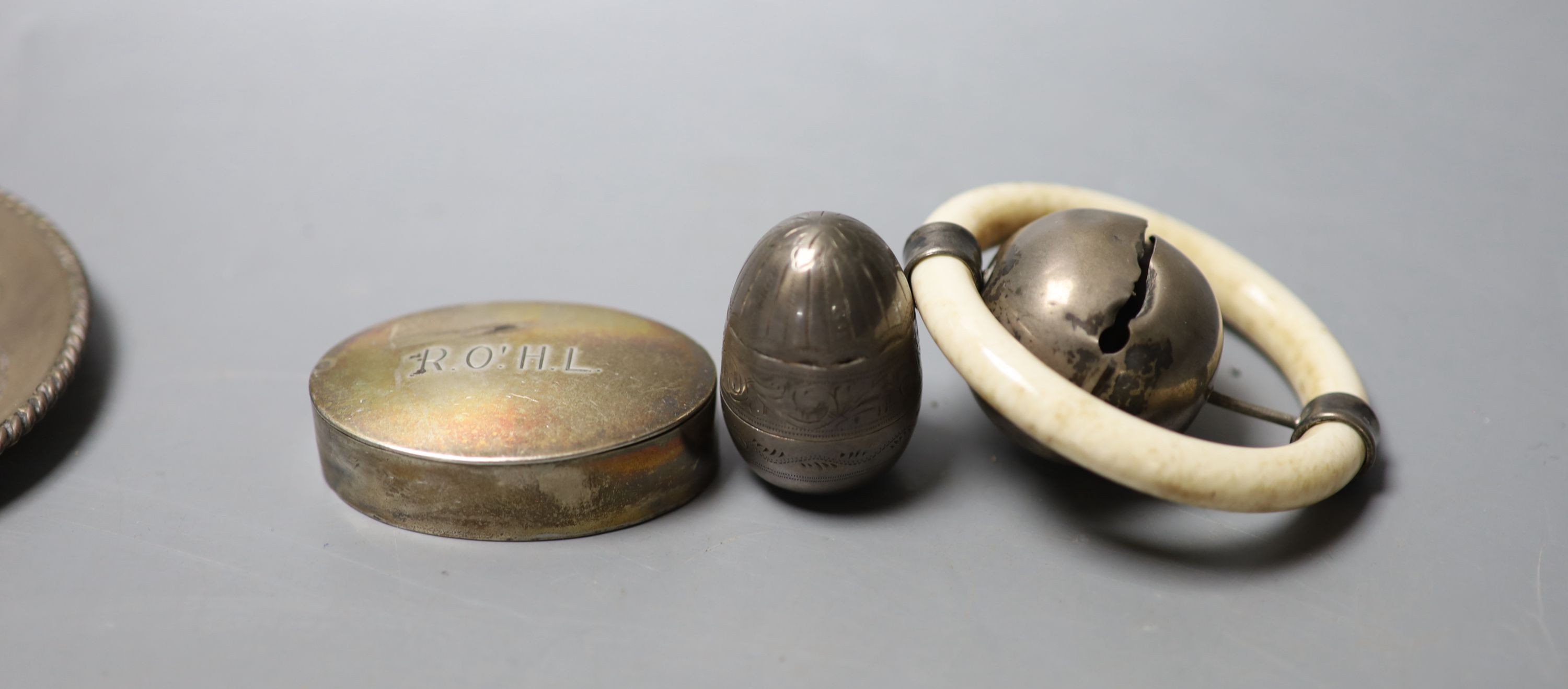 A silver and ivory baby's rattle with teething ring and a Mexican sterling 'hat' snuffer and three other items, including a mother of pearl mounted articulated fish and a silver pill box.